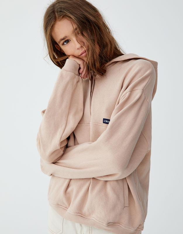 Sweatshirt with slogan on back