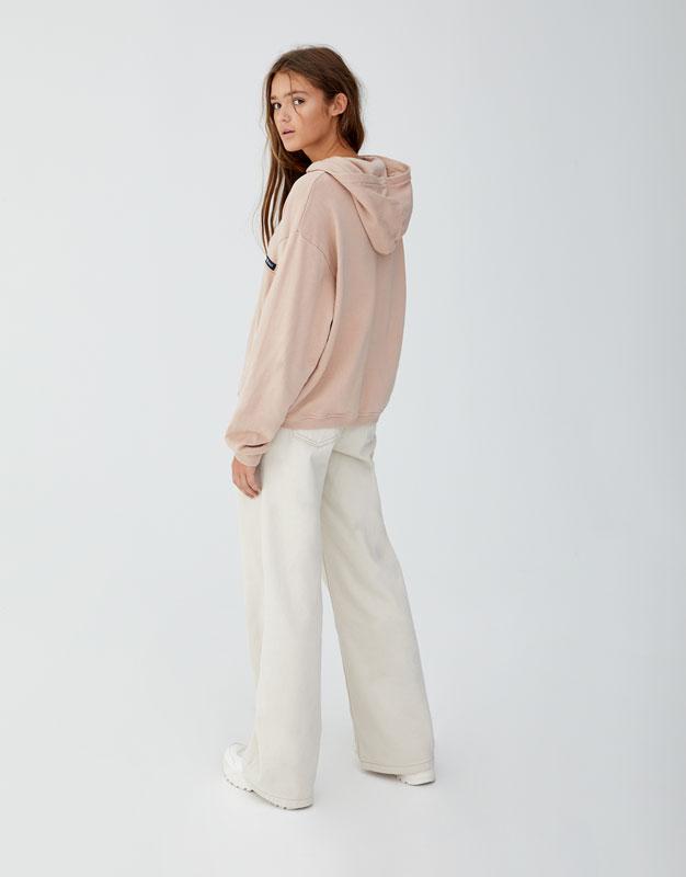 Sweatshirt with slogan on back