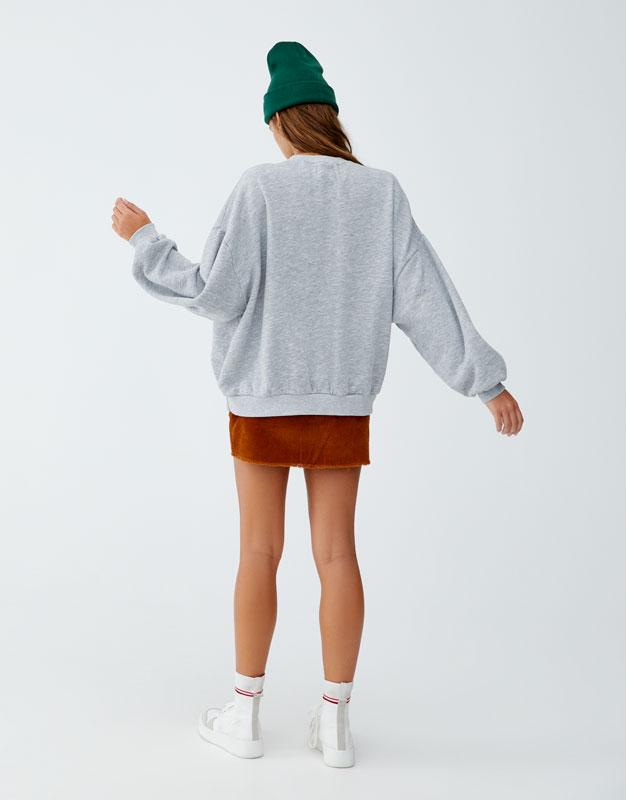 Sweatshirt with slogan on back